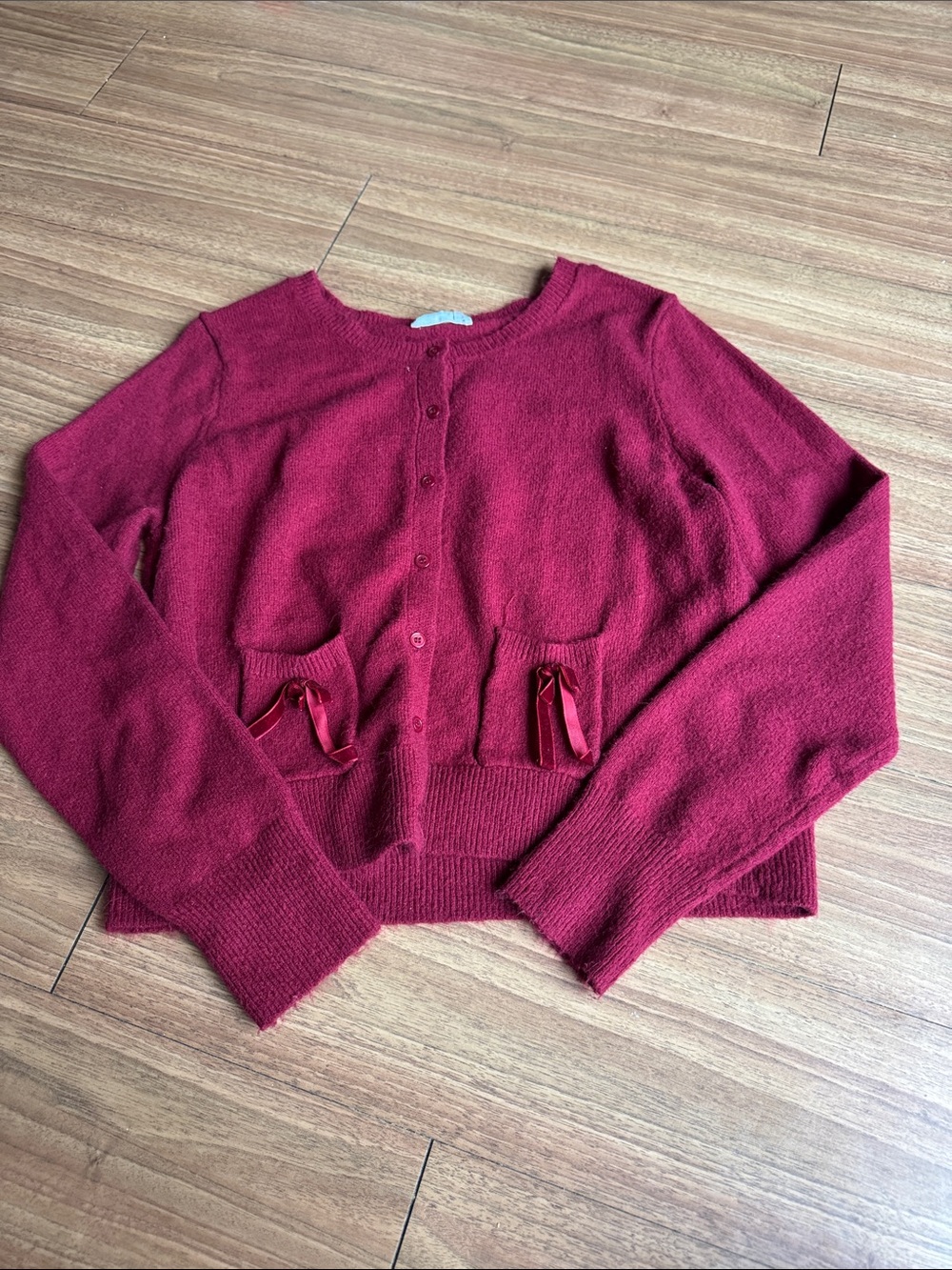 Red cardigan with bows